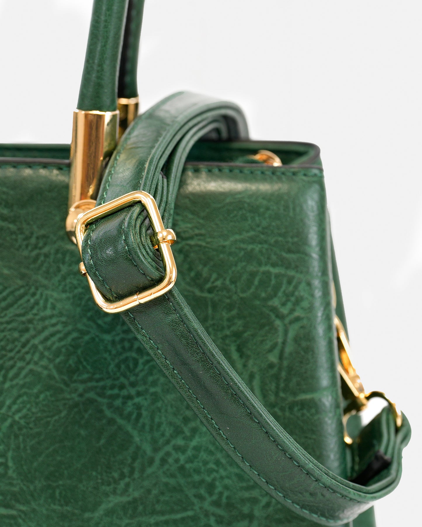 Handbag with pompom and metallic details