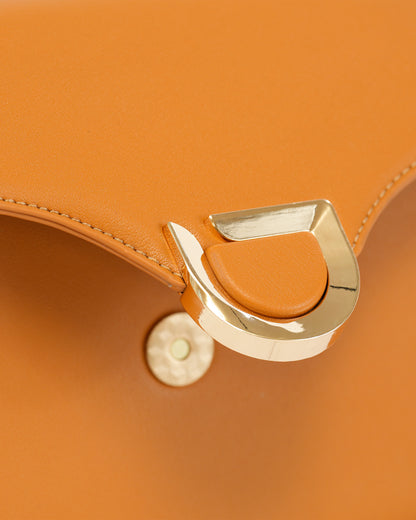 Elegant Crossbody Bag with Metal Closure and Adjustable Strap