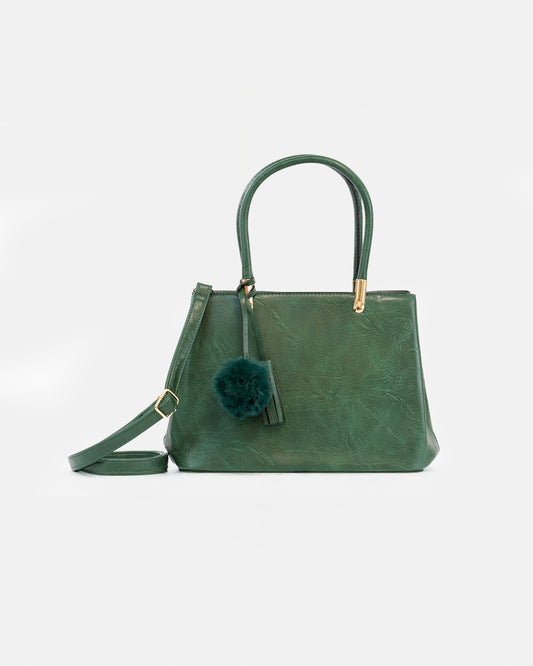 Handbag with pompom and metallic details